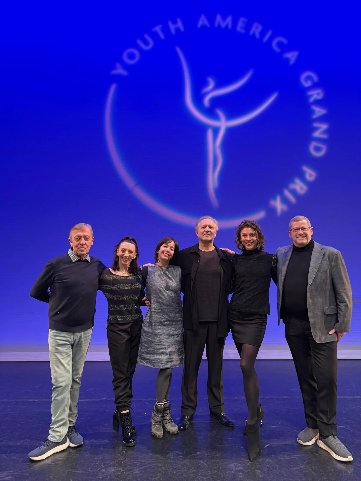 Maeghan McHale onstage with fellow Youth America Grand Prix judges