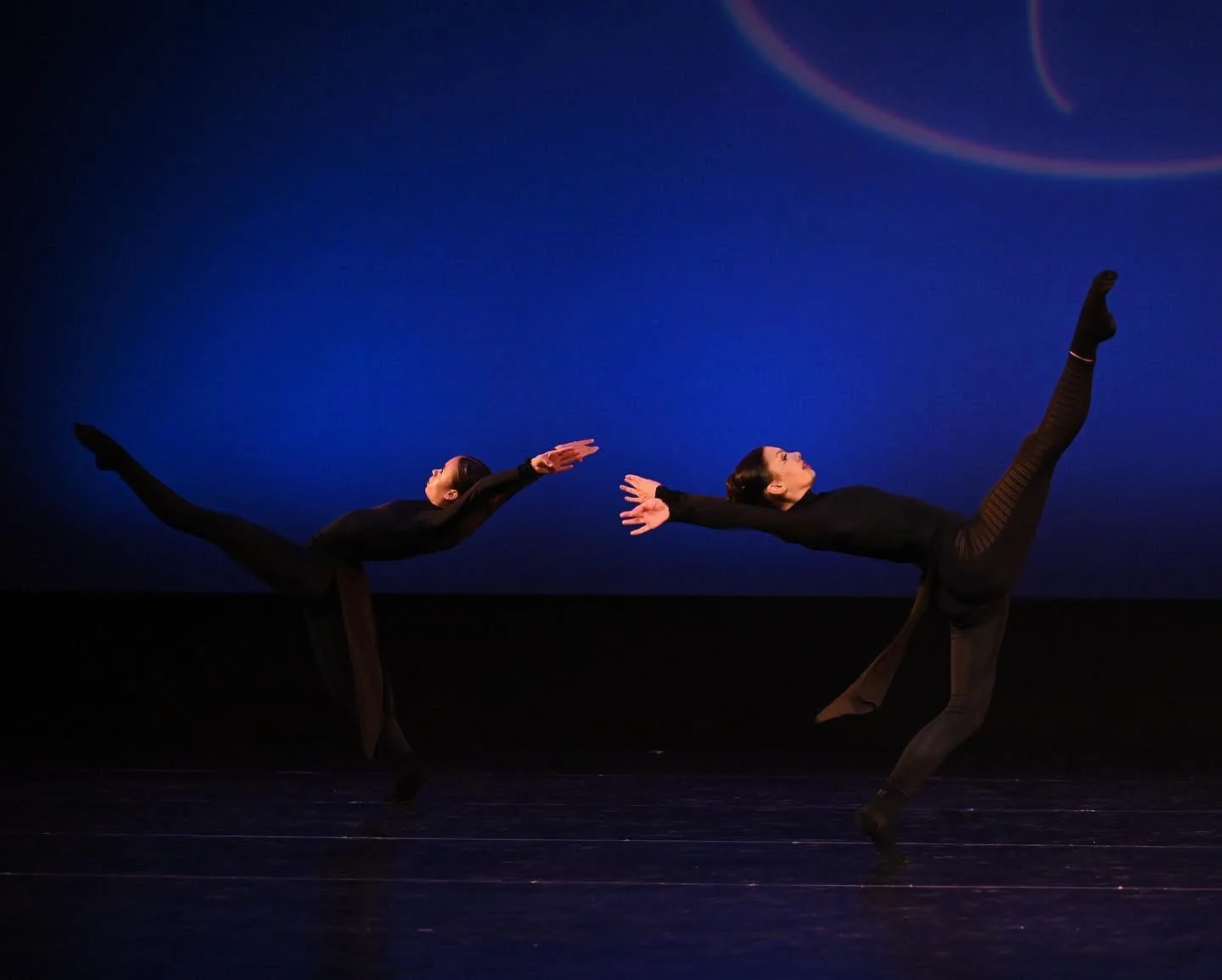 Dancers performing a contemporary duet